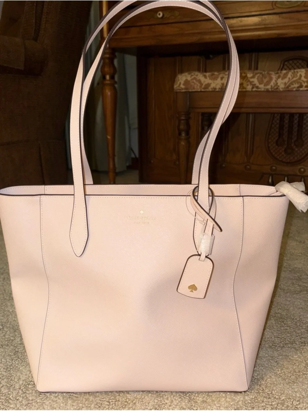 kate spade pale pink double-handle tote with luggage tag